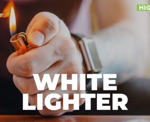 White lighter in a man's hand looking dangerous while lighting a joint