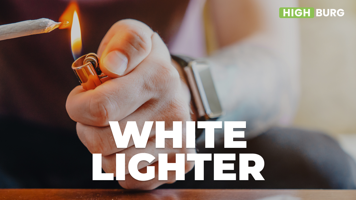 White lighter in a man's hand looking dangerous while lighting a joint